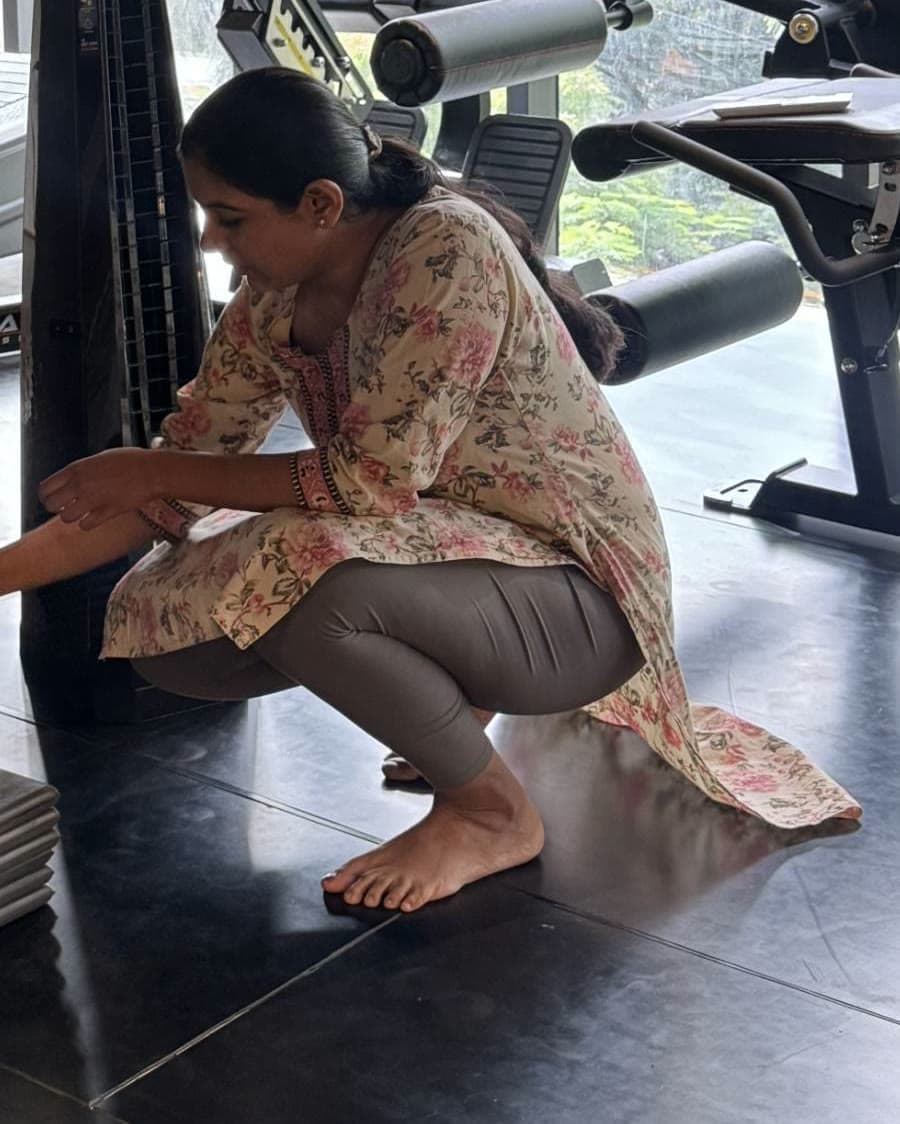 Physiotherapist Shushti Belekar assessing a client's ankle mobility at the studio